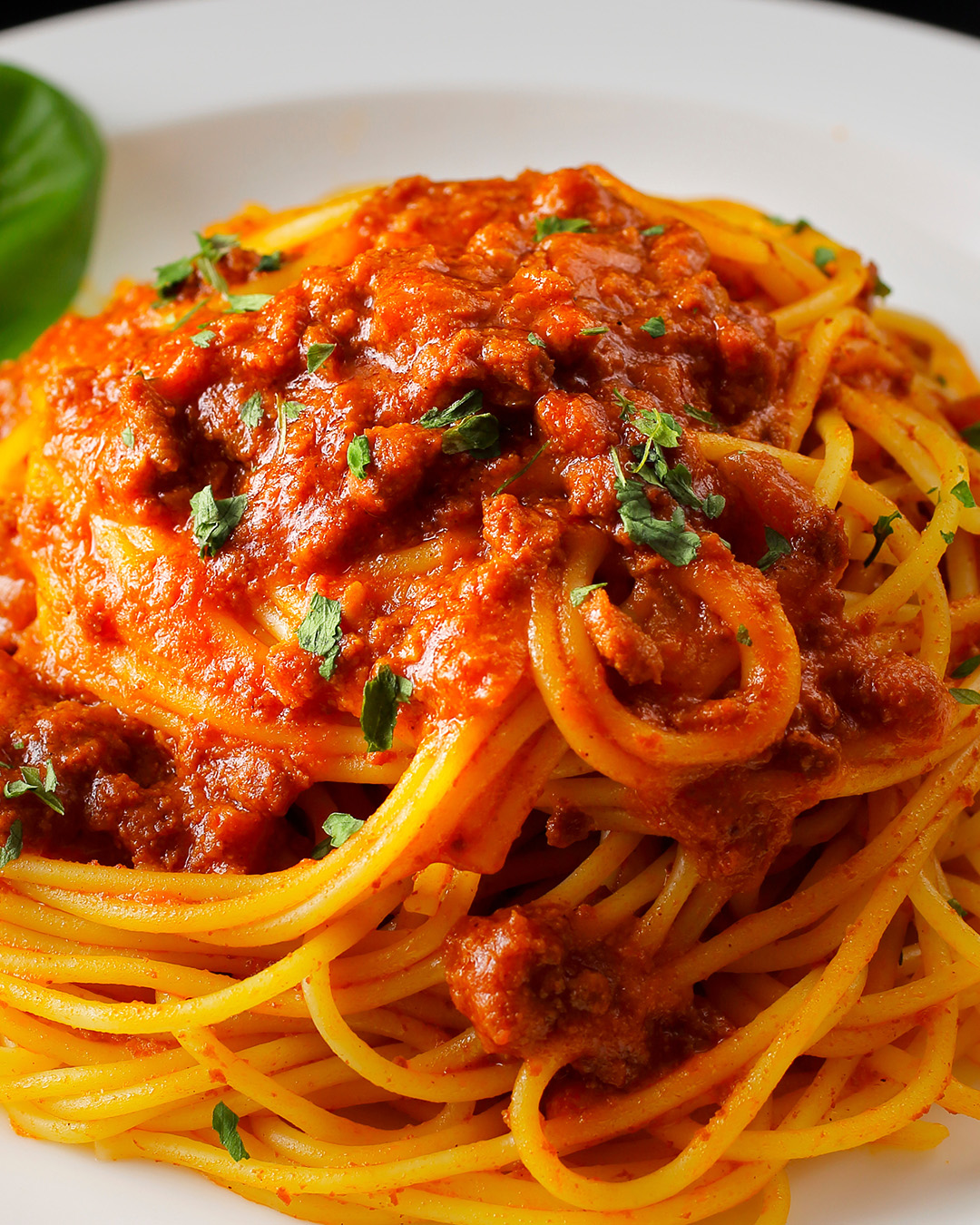 Spaghetti Bolognese. Slow-cooked beef and pork ragù, San Marzano tomatoes, fresh pasta, aged Parmigiano. Six hours of patience on a plate.
