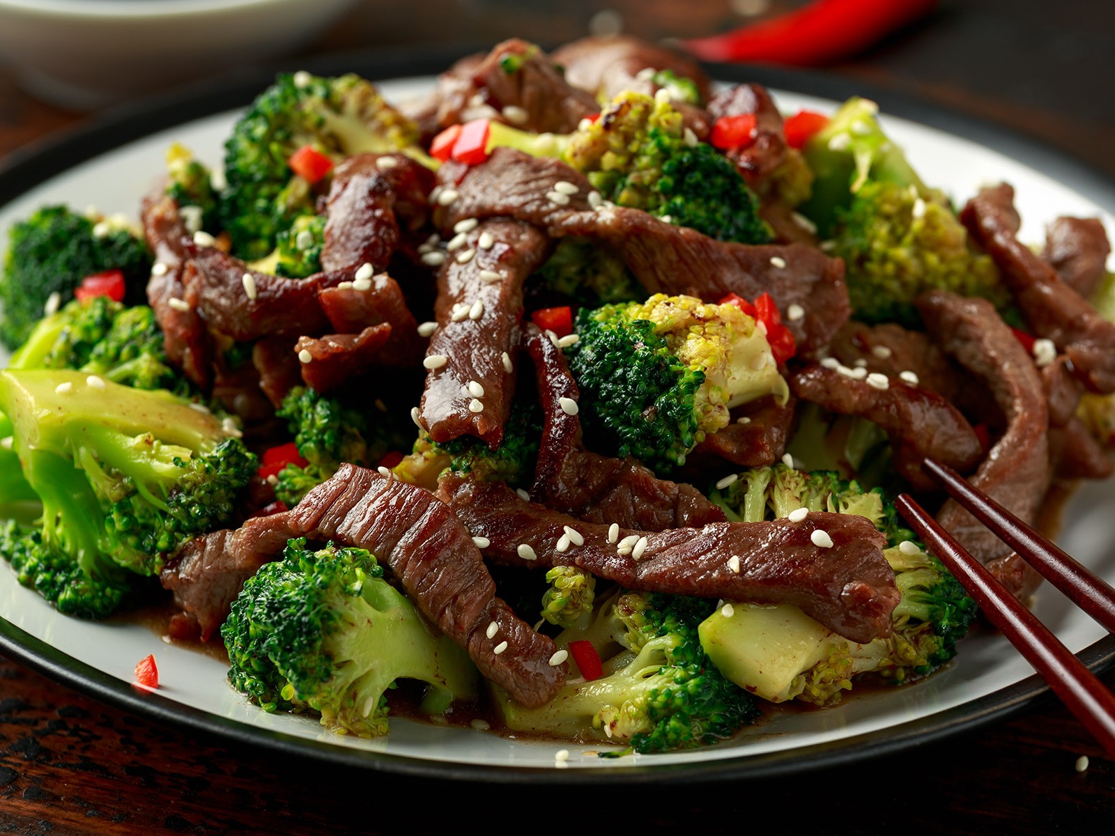 Thin-sliced flank steak velveted in baking soda and soy, wok-seared in batches, and tossed in a glossy oyster and hoisin sauce with crisp-tender broccoli. Better than takeout by a mile.