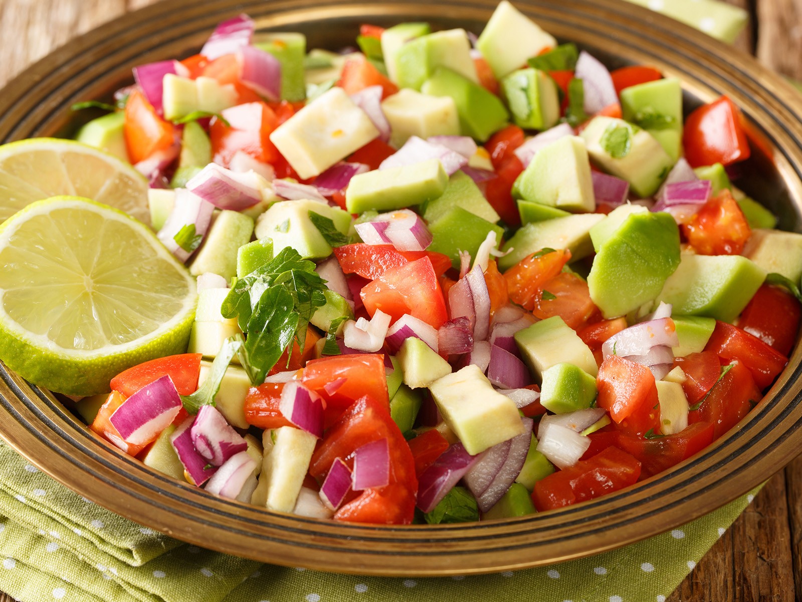 East Africa's answer to pico de gallo. Fresh tomatoes, red onion, cilantro, and green chile dressed in lemon juice. Simple, bright, and essential alongside grilled meats or rice dishes.