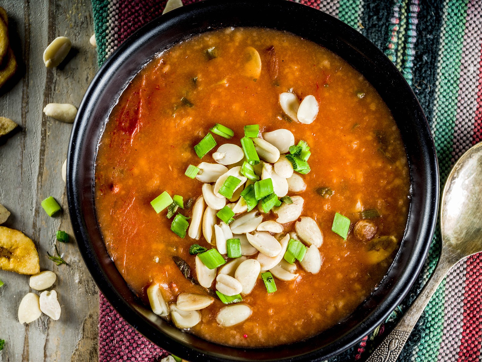 A rich, deeply savory soup of chicken, sweet potatoes, tomatoes, and peanut butter. Spiced with ginger, scotch bonnet, and smoked paprika. Served over rice. The soup that converts everyone who tries it.
