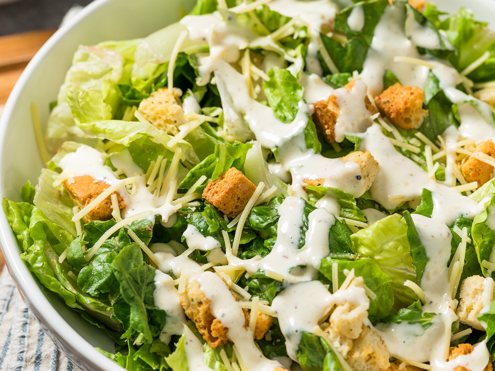 Made from scratch with a proper anchovy-garlic dressing that coats every leaf. Homemade croutons baked in butter and garlic. The kind of Caesar that converts people who think they don't like Caesar salad.
