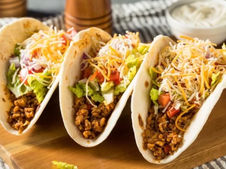 Seasoned ground beef in a homemade taco seasoning that beats every packet. Served in crispy corn shells with sharp cheddar, shredded lettuce, tomato, sour cream, and hot sauce. Tuesday is taco day.