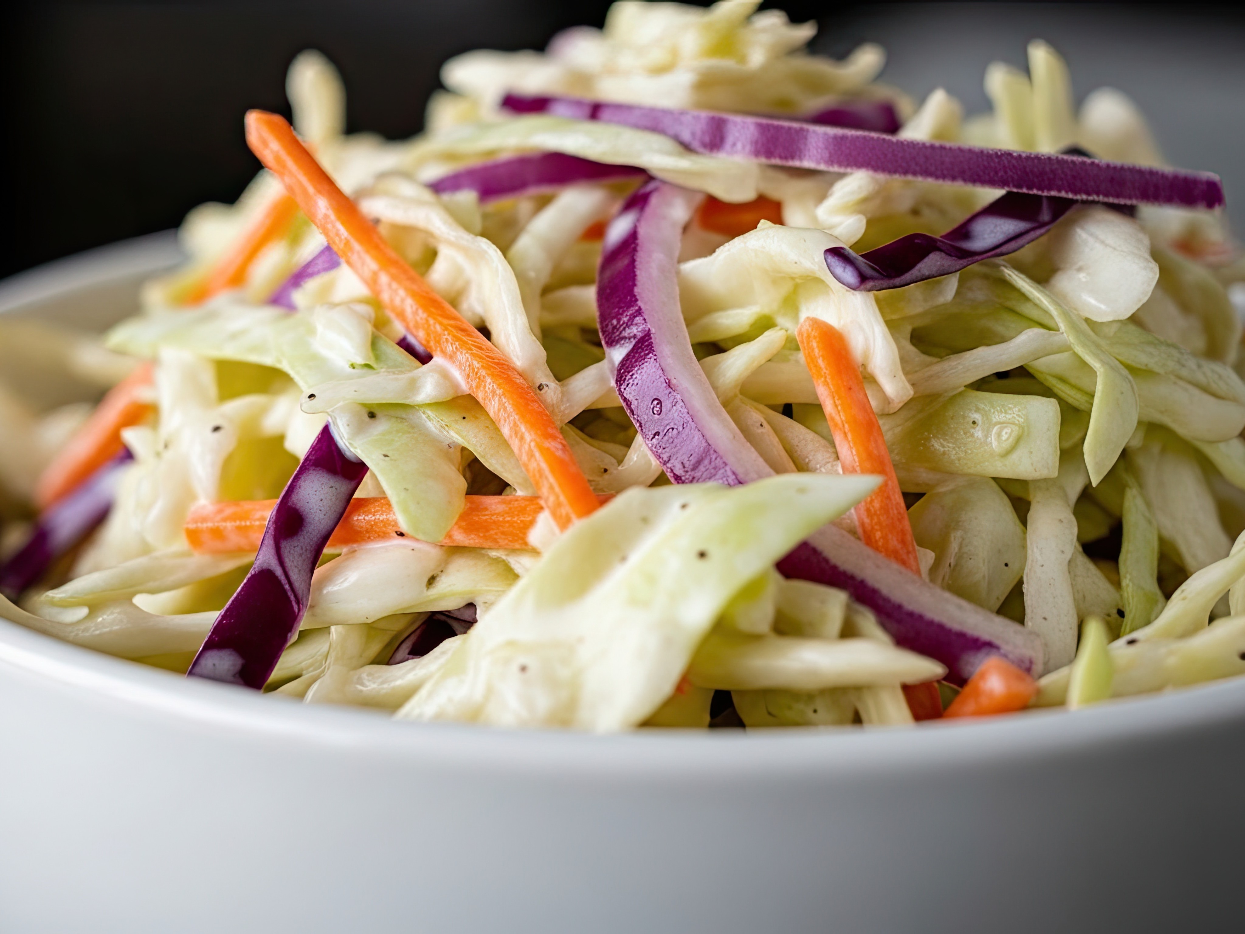 Creamy, tangy, perfectly crunchy. The secret is salting and draining the cabbage first. This coleslaw does not get watery and holds up beautifully on pulled pork sandwiches or fish tacos.