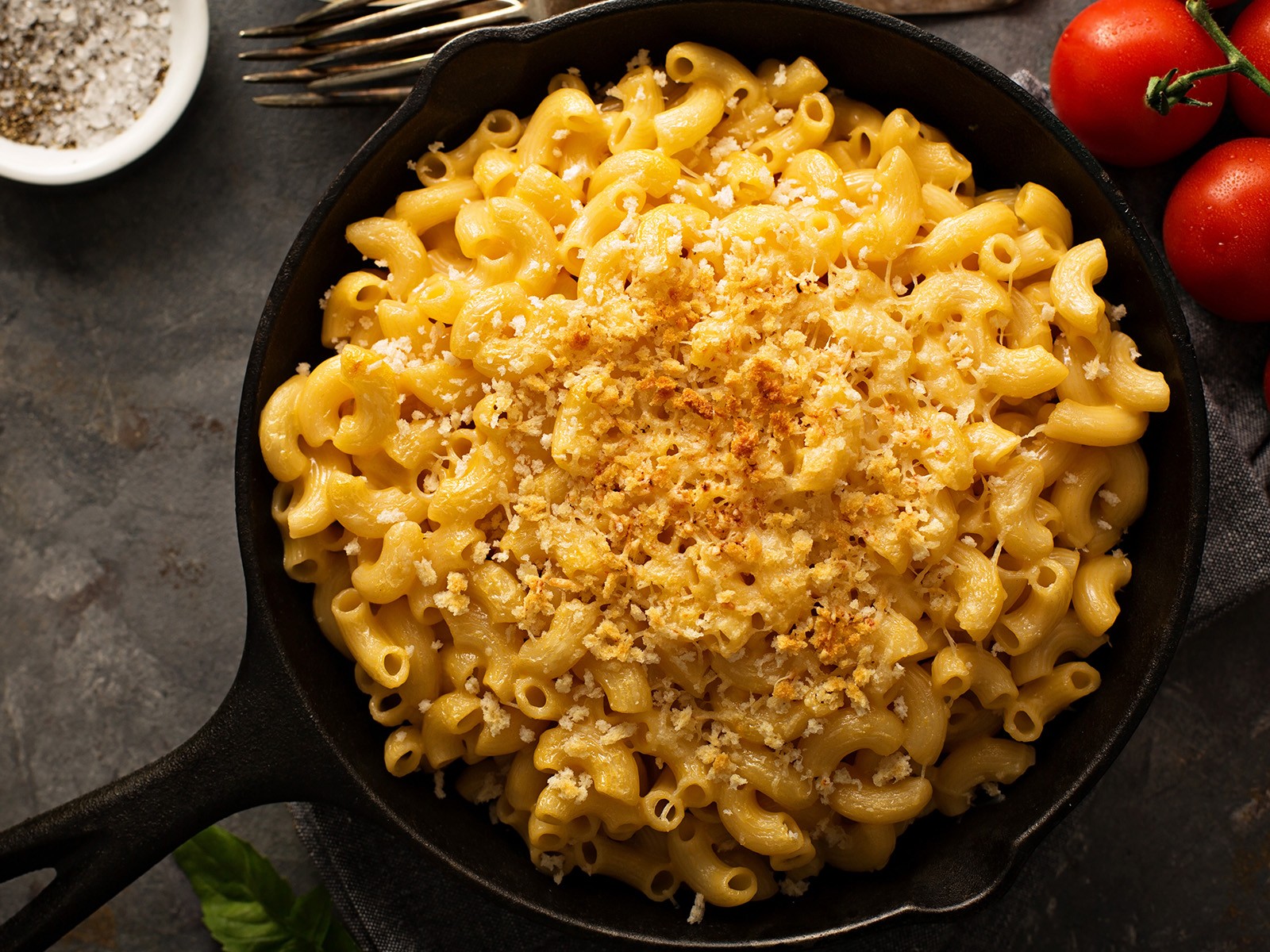 A real béchamel base with three cheeses — sharp cheddar, gruyère, and a touch of velveeta for the stretch. Cooked on the stovetop, never baked. Creamy, coating, unapologetically rich.