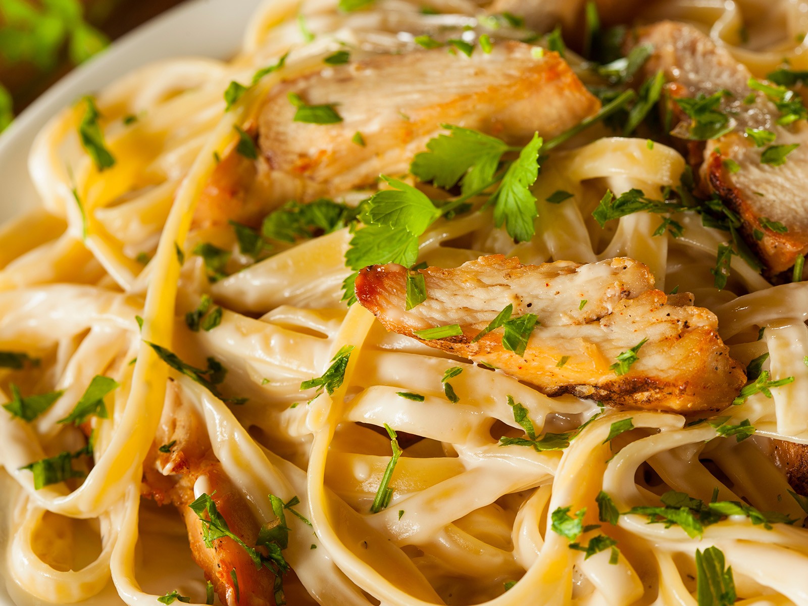 Real Alfredo is just pasta, butter, and parmesan. No cream. The pasta water is the sauce. This requires technique — constant tossing, the right heat, the right cheese — but when it works, nothing is better.