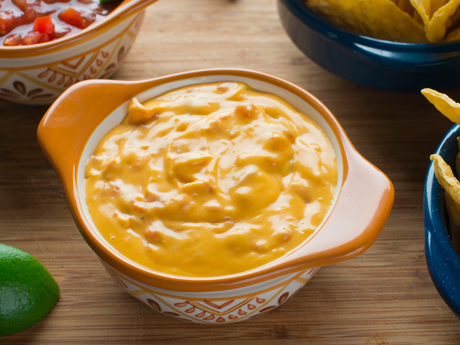 The real deal Tex-Mex queso. Velveeta is the secret — I said what I said. With roasted poblano, tomatoes, and spiced ground beef stirred in. Impossible to stop eating.