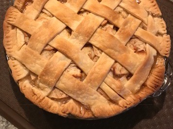 A flaky all-butter crust with a filling of Honeycrisp apples seasoned with brown sugar, cinnamon, nutmeg, and a splash of bourbon. The crust is the test. This one passes.