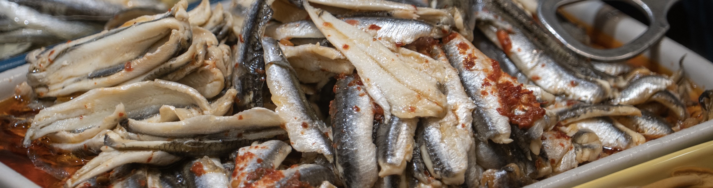 Crunchy toast topped with spicy, oil-packed sardines, fresh lemon, and zesty herbs. The ultimate salty, savory, and effortless snack.