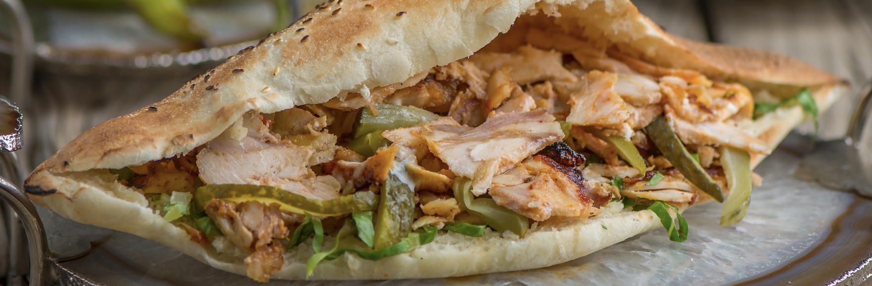 Marinated chicken roasted to perfection, filled with aromatic spices. Served in warm pita with creamy garlic sauce.