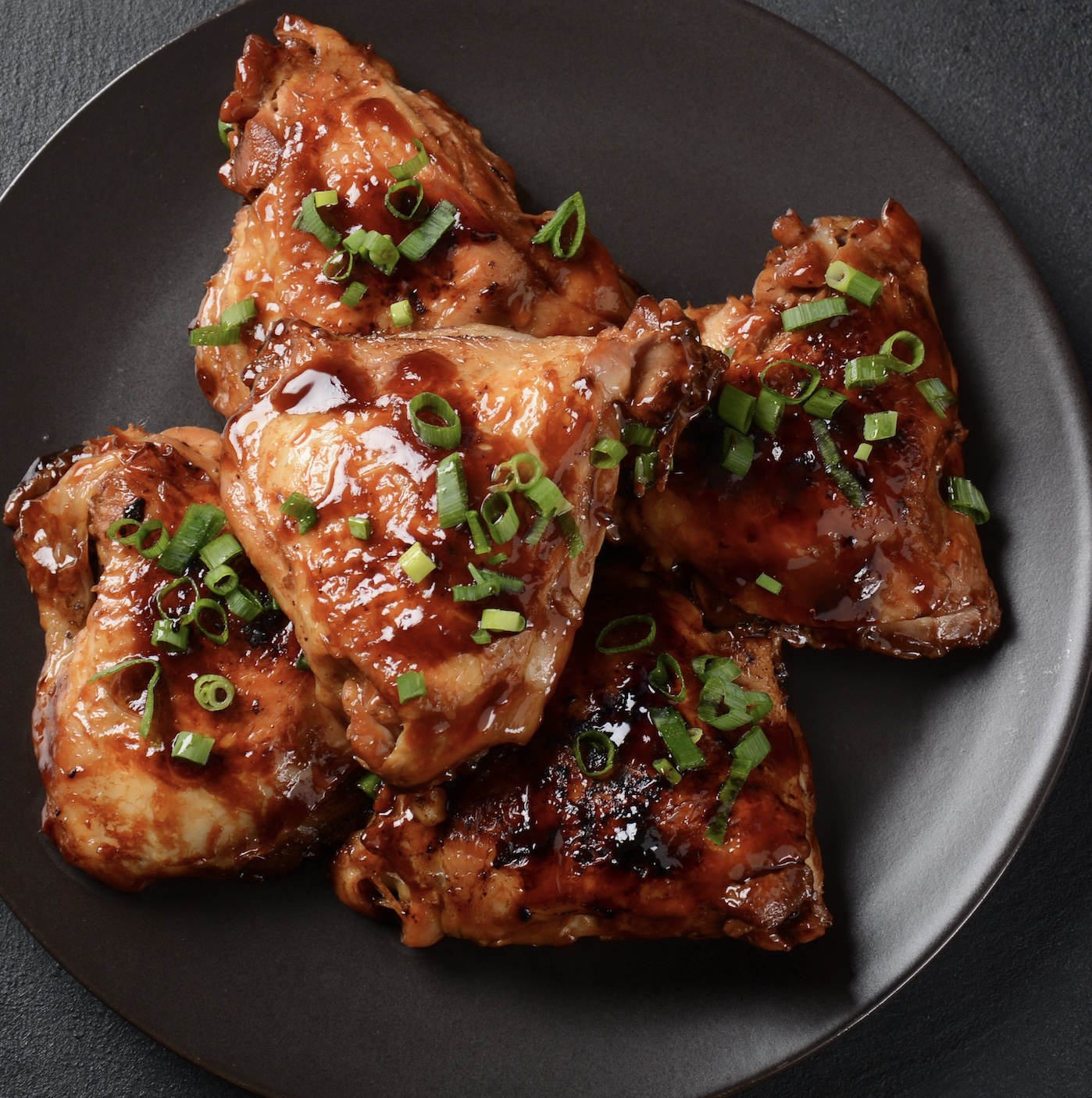 Chicken Adobo is the unofficial national dish of the Philippines—savory, tangy, and deeply comforting. Chicken is braised in soy sauce, vinegar, garlic, and bay leaves until tender and flavorful. The sauce reduces into a rich glaze that clings to the meat.