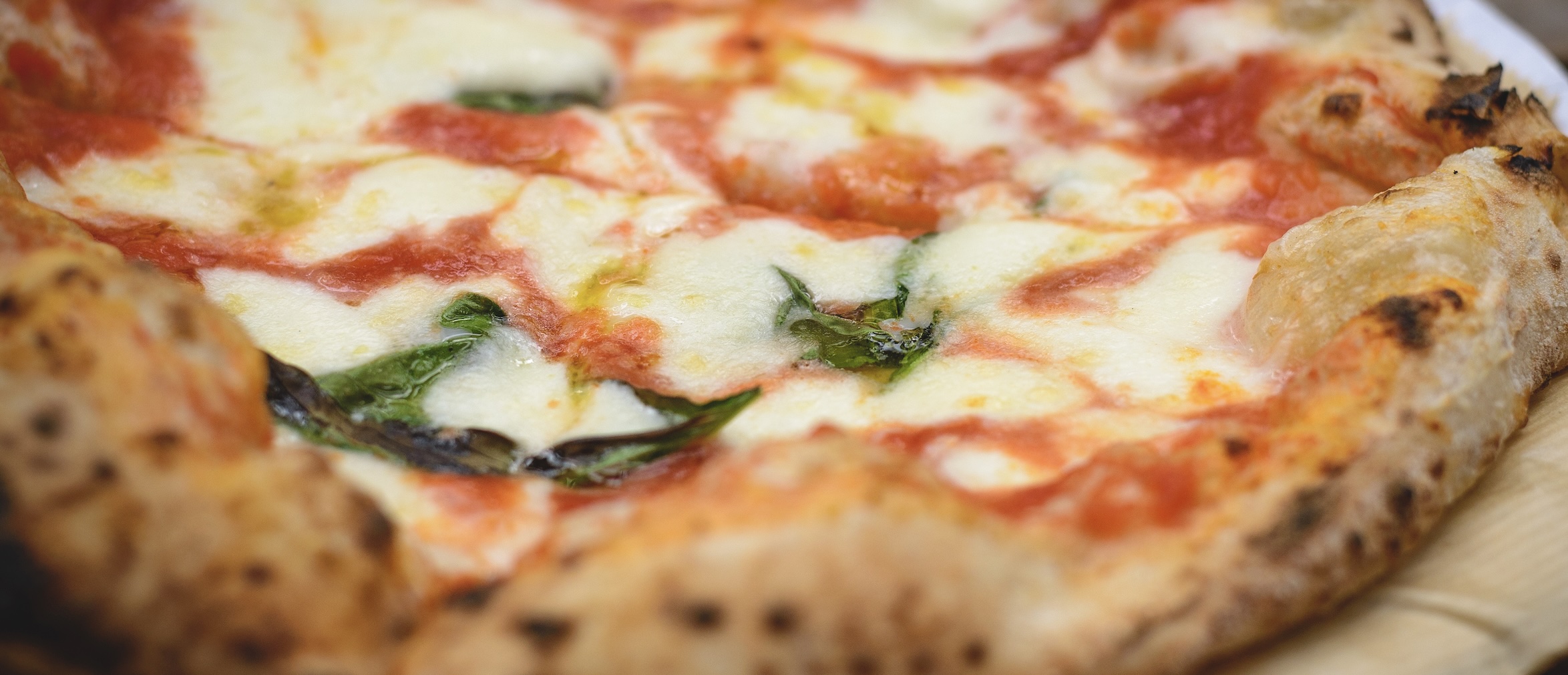 Classic pizza with tomato, mozzarella, and basil. Simple ingredients, bold flavor.