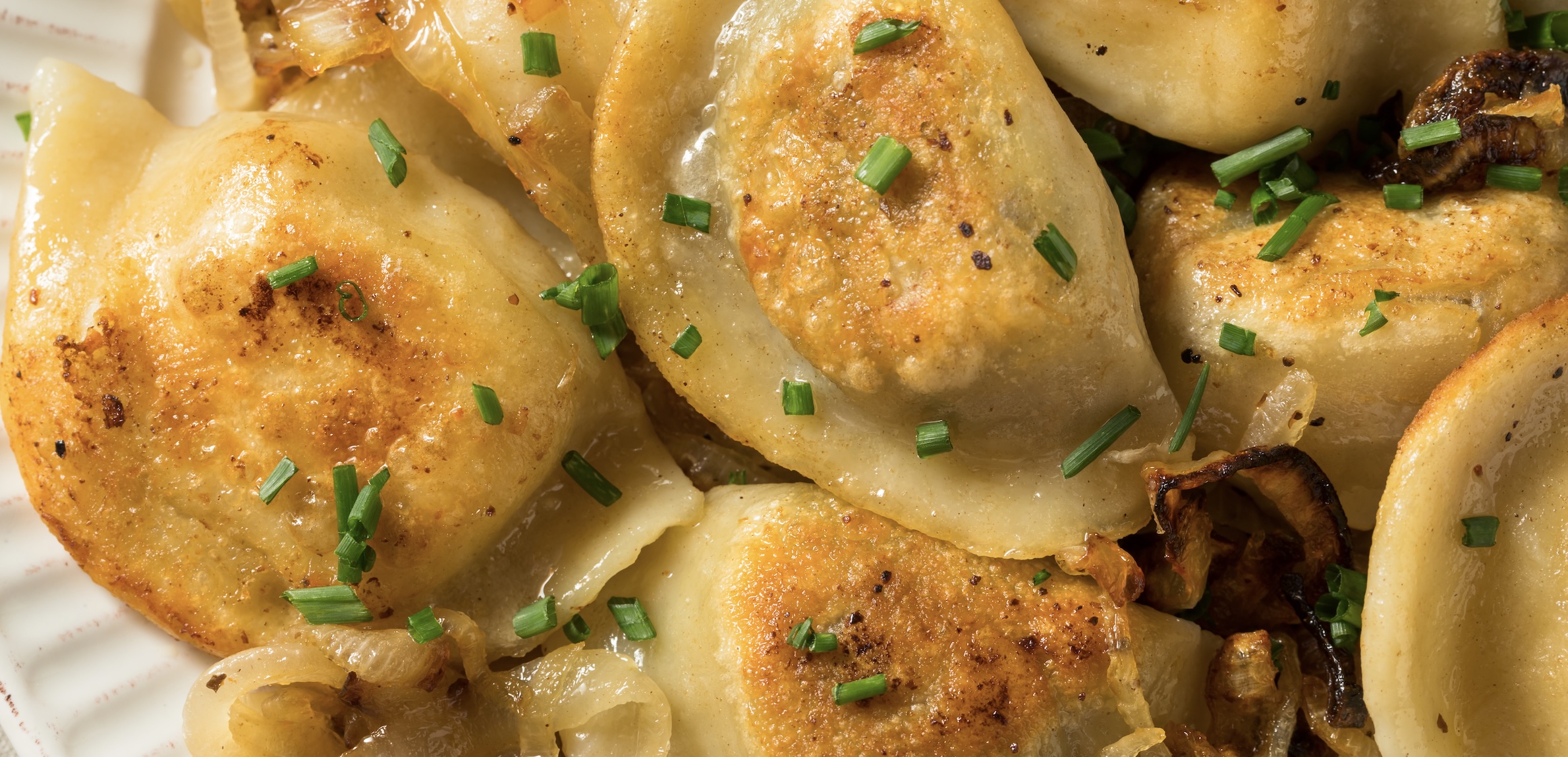 Soft dumplings stuffed with potato and cheese, boiled then pan-fried in butter. Comforting and rich.