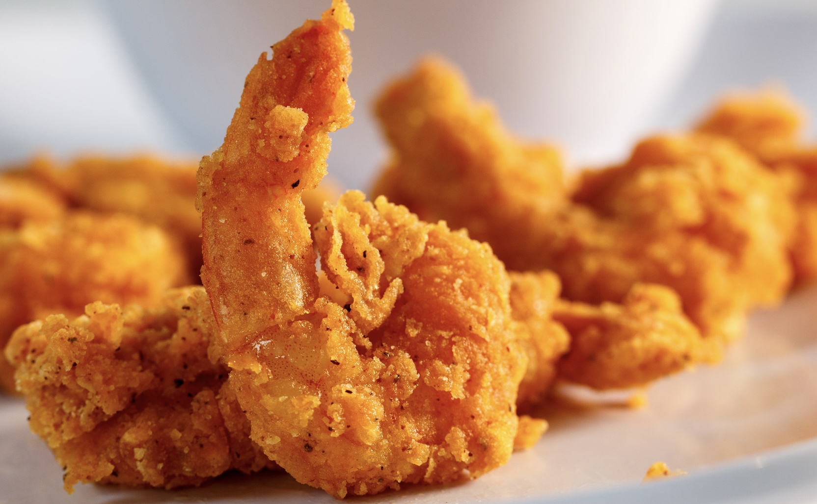 Crispy, golden shrimp with a seasoned coating. Light crunch and juicy inside—perfect coastal classic. Fresh shrimp works best! **If using frozen shrimp be sure to soak them in water overnight to rehydrate them so the shell doesn't stick to the meat when peeling.**