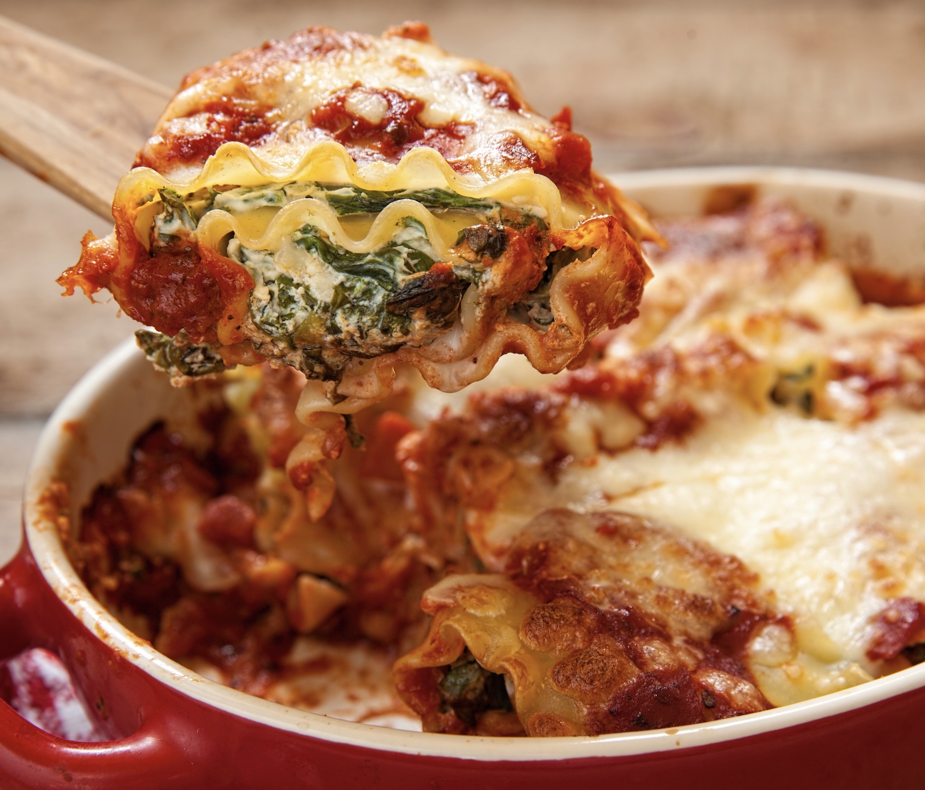 The ultimate comfort food. Layers of pasta, savory tomato sauce, spinach, and creamy ricotta cheese. Hearty, warm, and crowd-pleasing.
