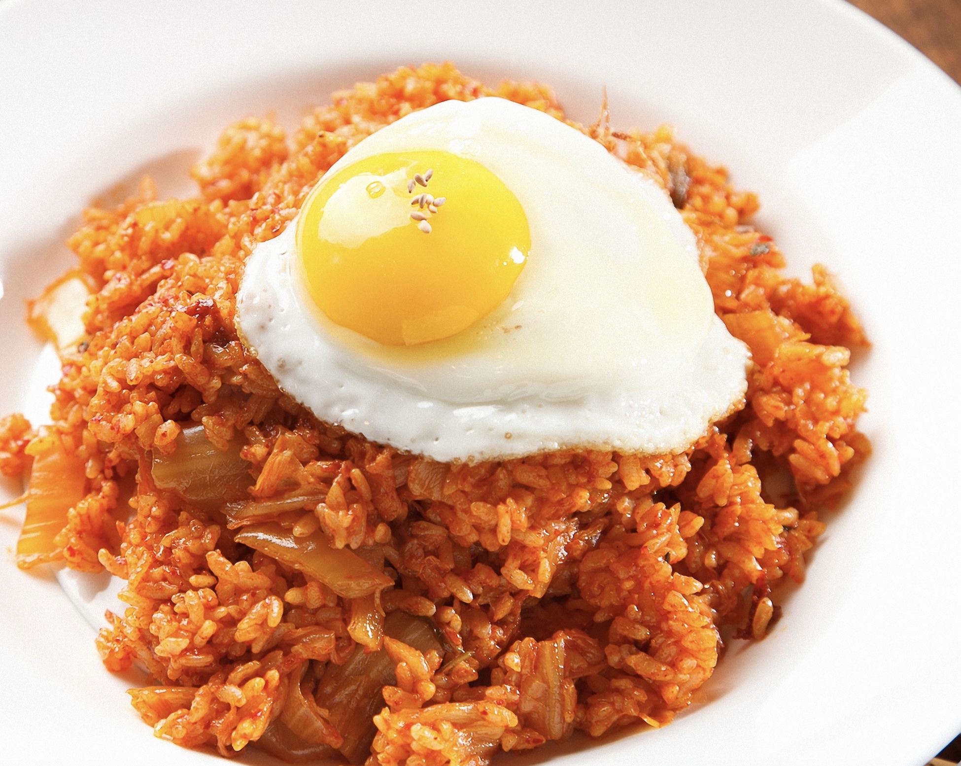 A quick, spicy, and tangy favorite. Stale rice and kimchi fried with savory sauce. A perfect way to use leftovers.