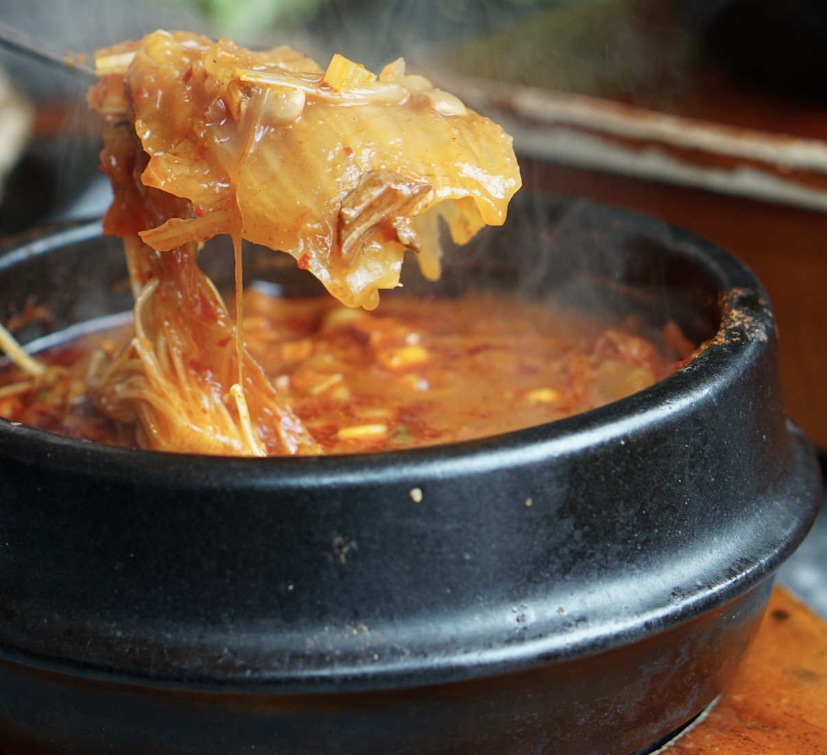 A deeply comforting, spicy stew made with aged kimchi and pork belly. Best served bubbling hot with rice. One of the most popular dishes in Korea, I'm told.