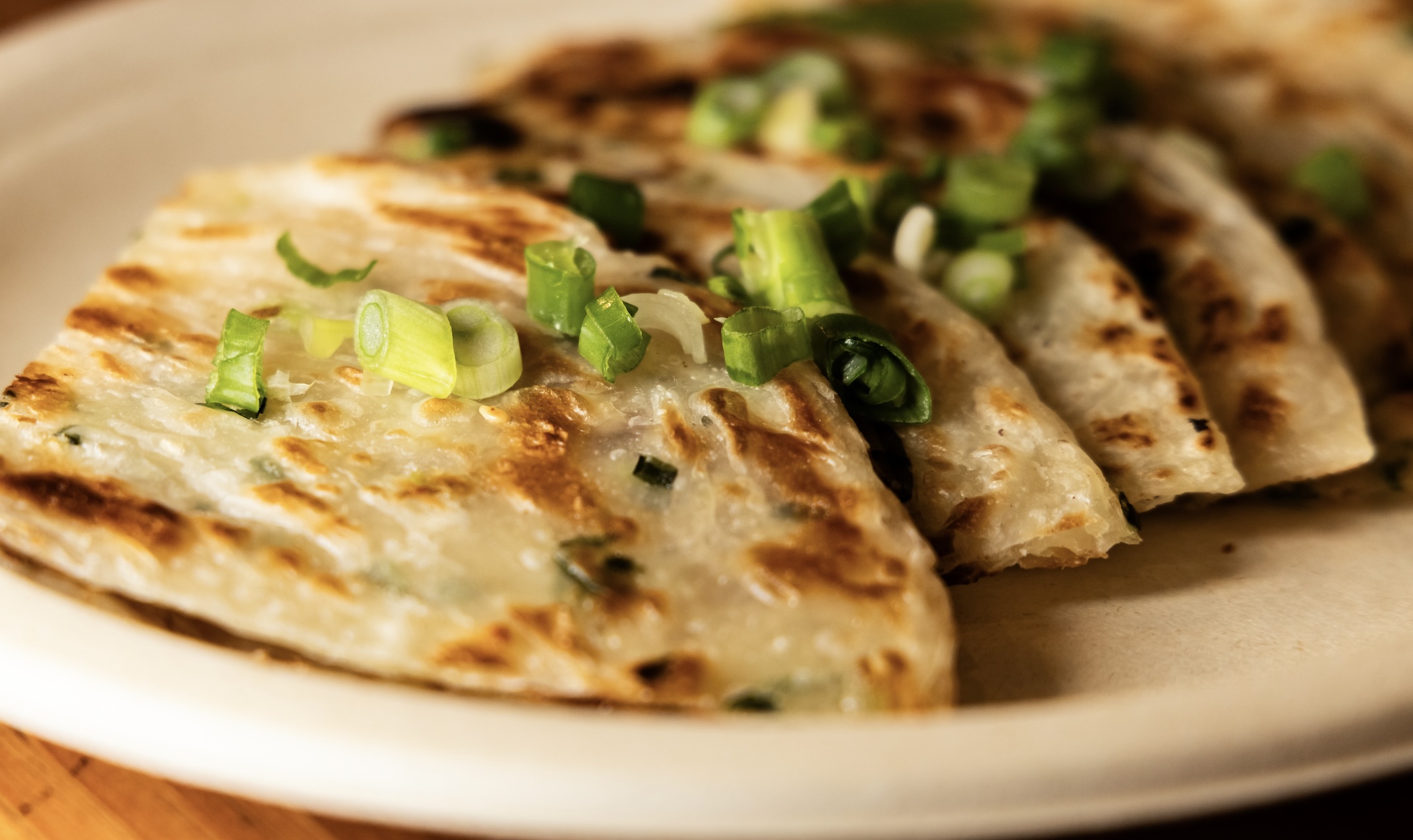 Crispy, savory pancakes packed with scallions and served with a tangy soy-dipping sauce. A perfect appetizer...or breakfast, lunch, or dinner. Quick and easy to make.