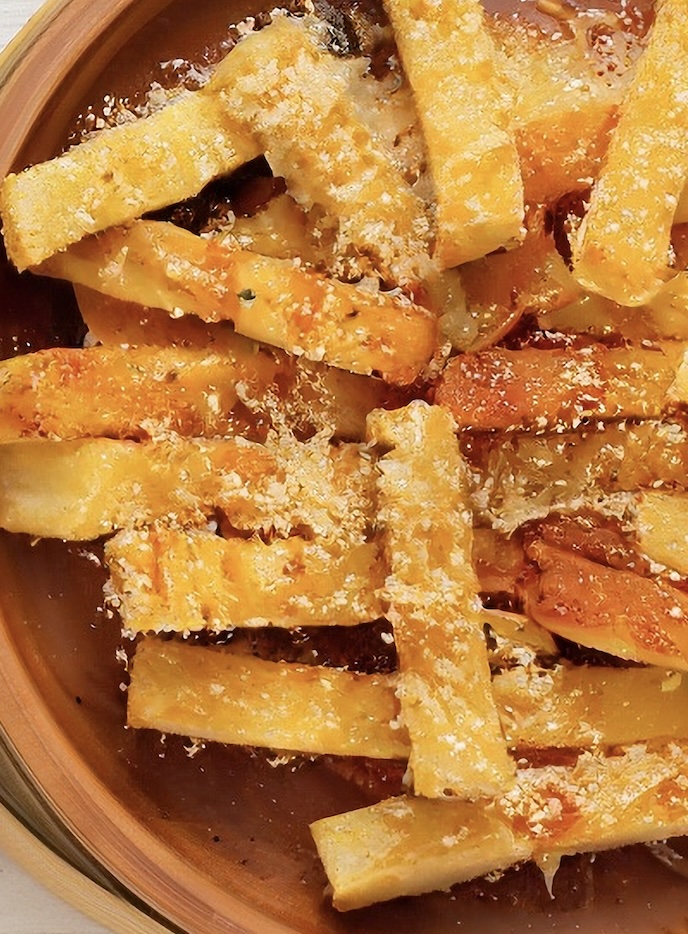 The perfect crispy appetizer. Creamy polenta sticks fried until crunchy, served with a rich, tangy Gorgonzola fondue for dipping. If the blue cheese flavor of gorgonzola isn't your thing, dip them in some marinara. Perfect combo.