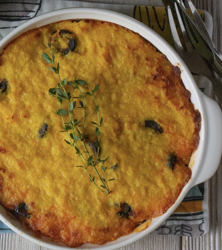 A savory corn pie layered with seasoned ground beef, onions, olives, and hard-boiled eggs. Might sound like an odd combination but it is a sweet and savory meal.