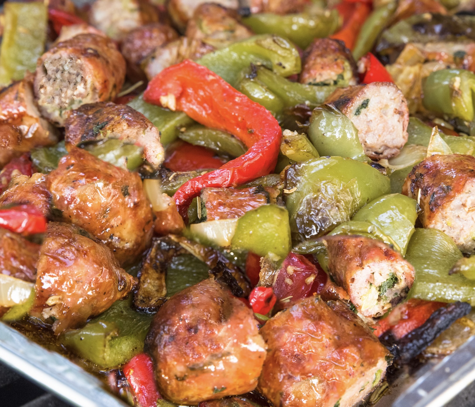 Savory Italian sausages slow-cooked with sweet peppers and onions. It’s a flavor-packed meal that works over pasta, rice, polenta, or you can serve as a sub. Very versatile. No crockpot? The sheet pan version carmalizes the onions. Recipe for that below too.